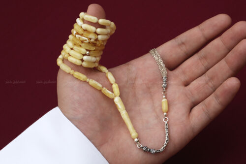 كهرم (كهرمان) طبيعي مخروط من نقتس مع شرابة فضة