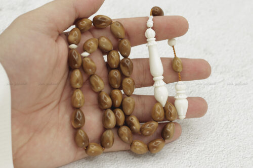 كوك مع عظم دمعة ٣٣ خرزة٣ خشب ثمرة الكوك مع عظم الجمل (قصة الدمعة)