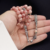 ⁨مسباح حجر الرودوكروزيت Rhodochrosite طبيعي مع شرابة فضة